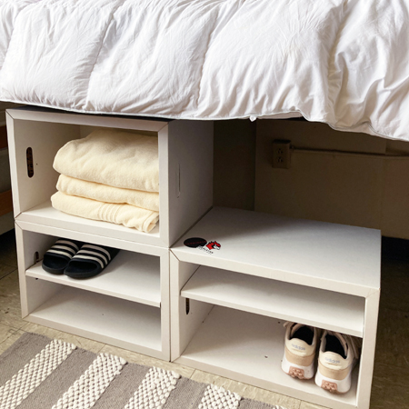 Muvo Box used as under-bed storage in a dorm room